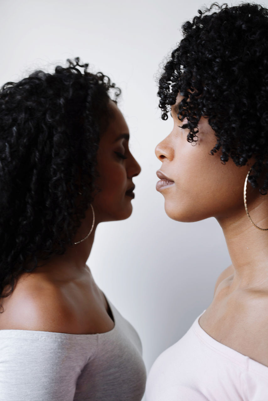 Two beautiful african women opposite each other portrait