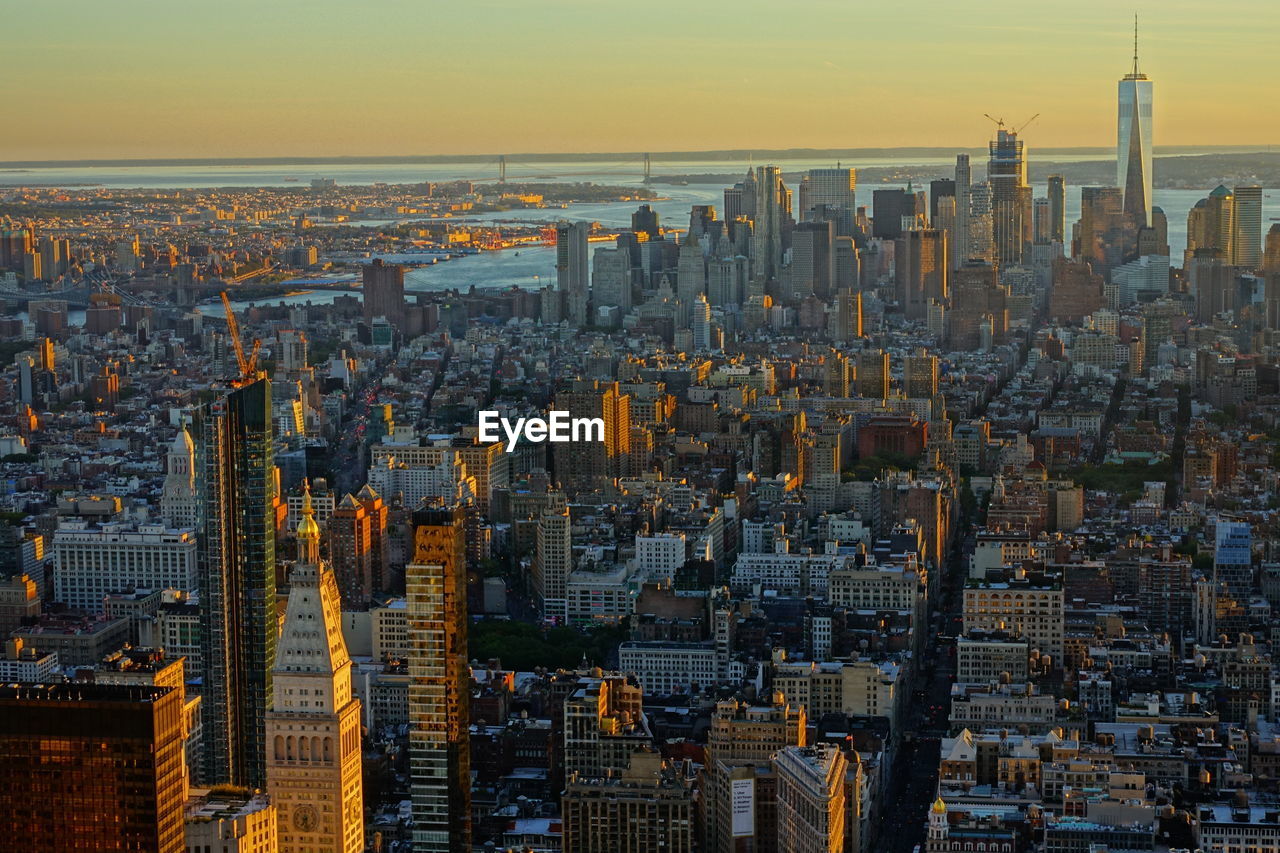 Aerial view of city buildings during sunset