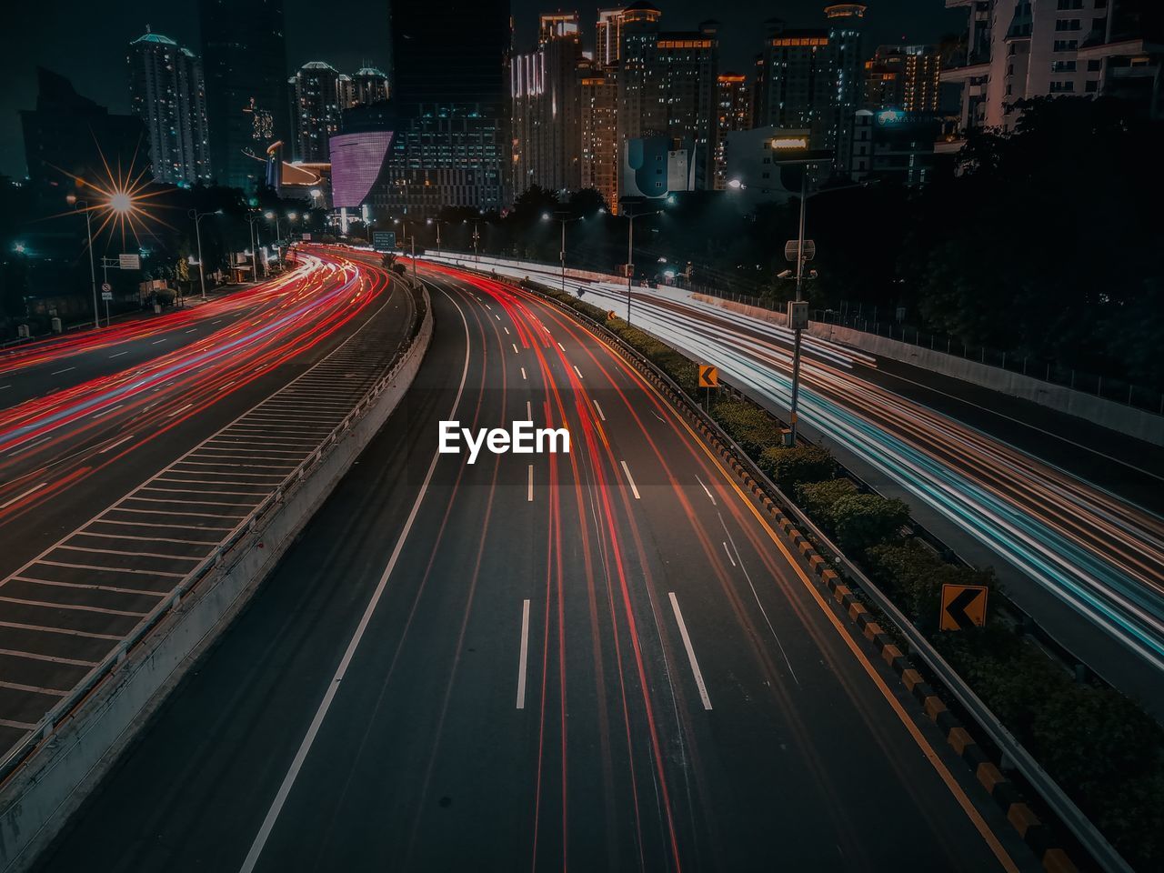 High angle view of light trails on road at night