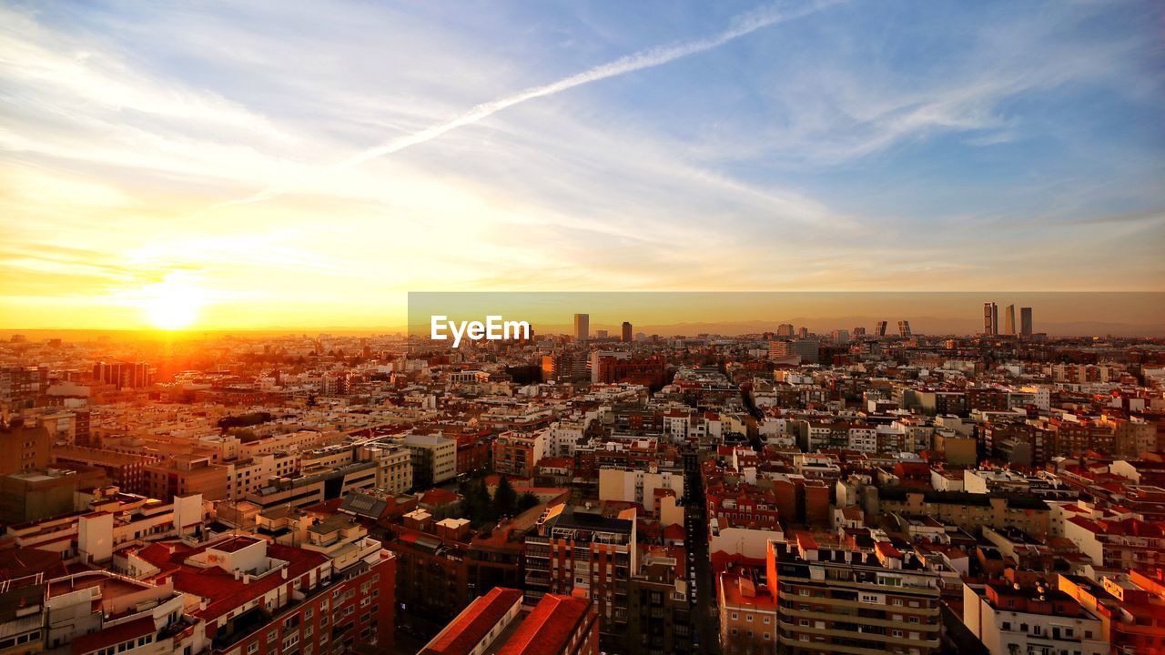 High angle view of buildings against sky during sunset