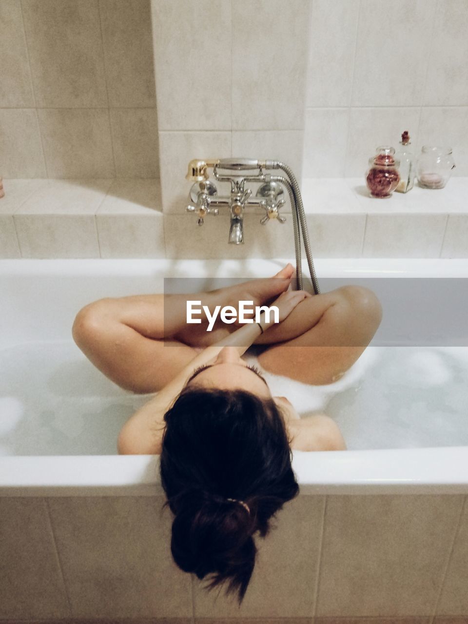 Directly above shot of young woman in bathtub