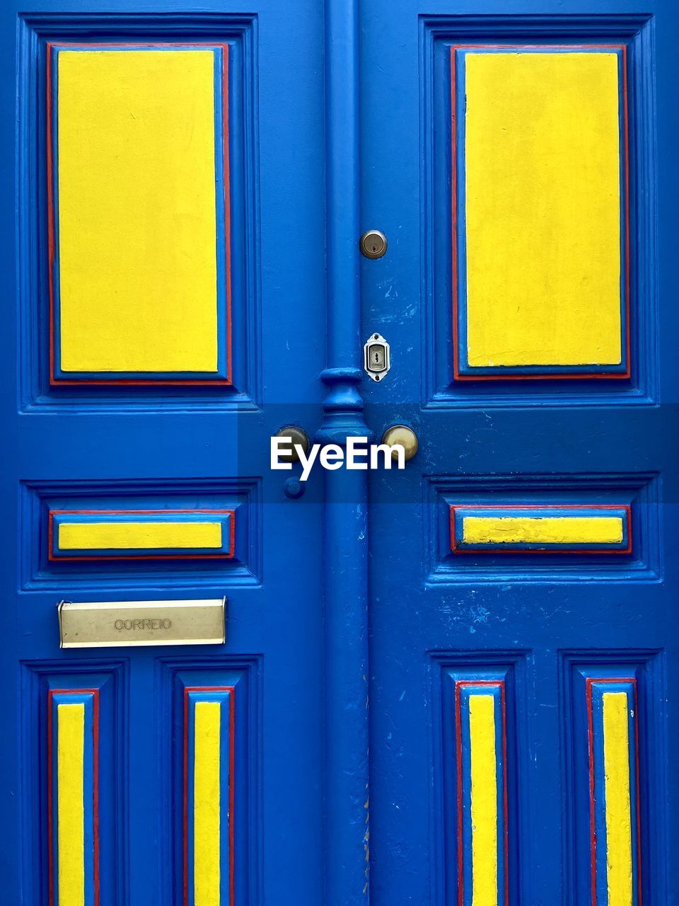 Full frame of blue and yellow door