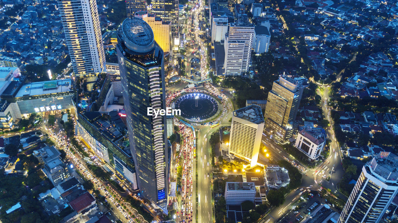 High angle view of city buildings at night