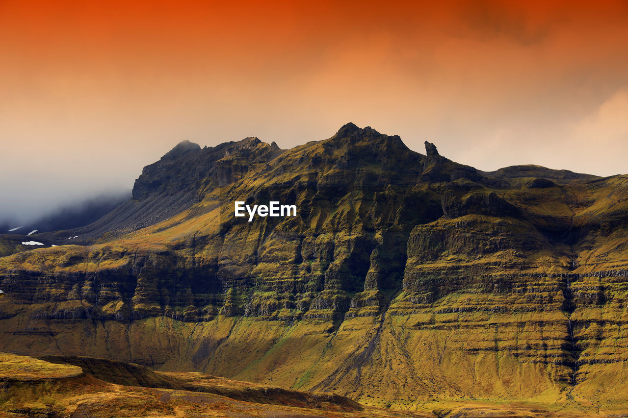 SCENIC VIEW OF MOUNTAIN RANGE AGAINST SKY DURING SUNSET