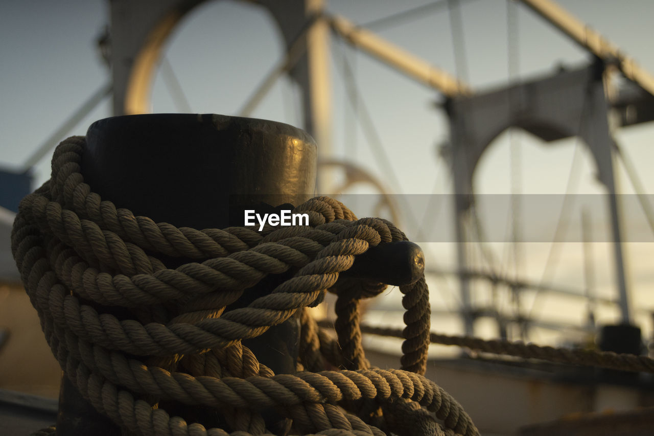 Close-up of rope tied to bollard