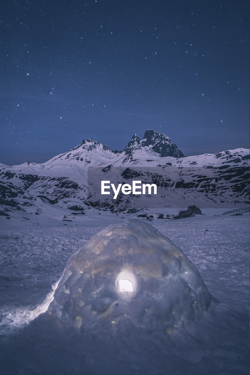 Igloo under starry sky against midi d'ossau during winter, laruns, fr