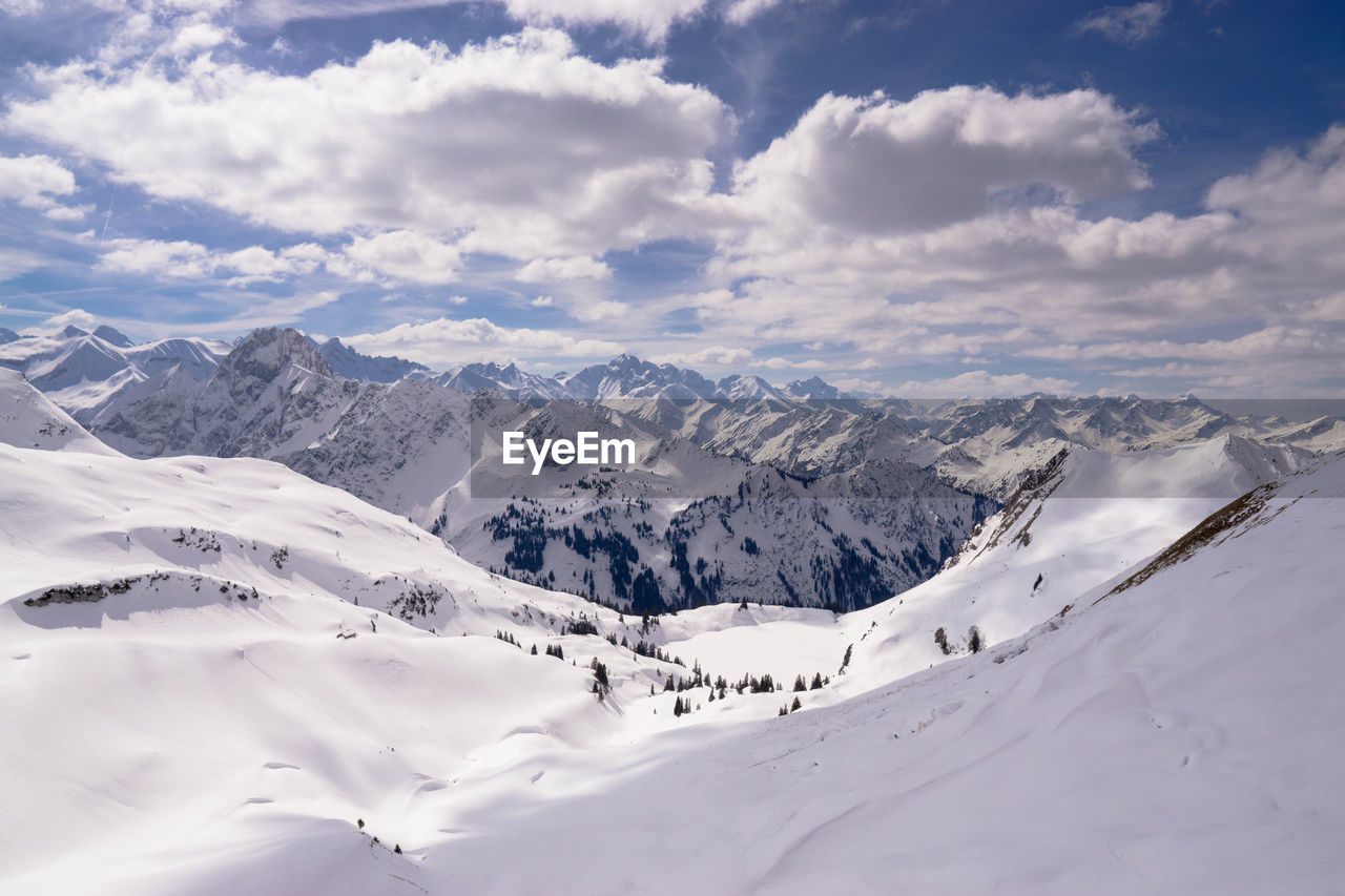 Scenic view of snowcapped mountains against sky