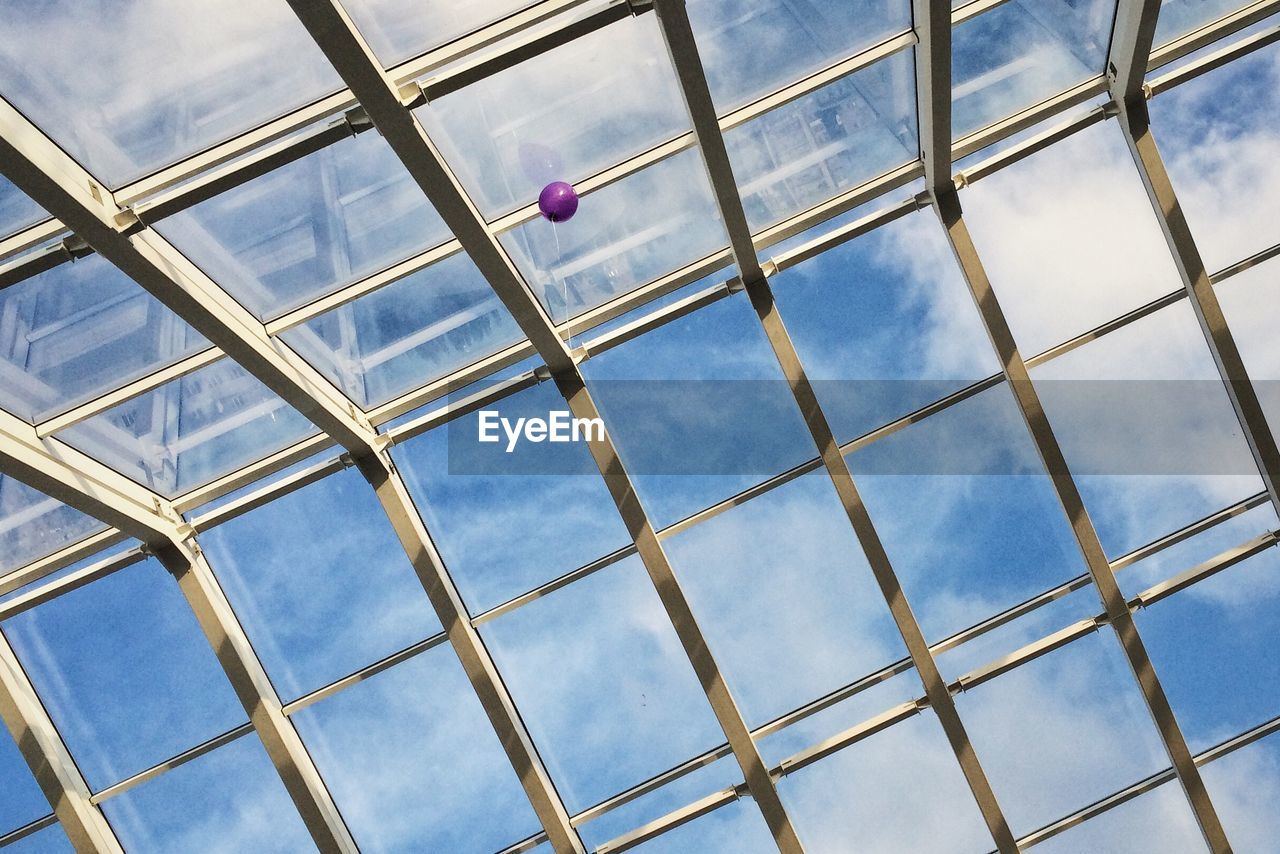 Low angle view of balloon and skylight