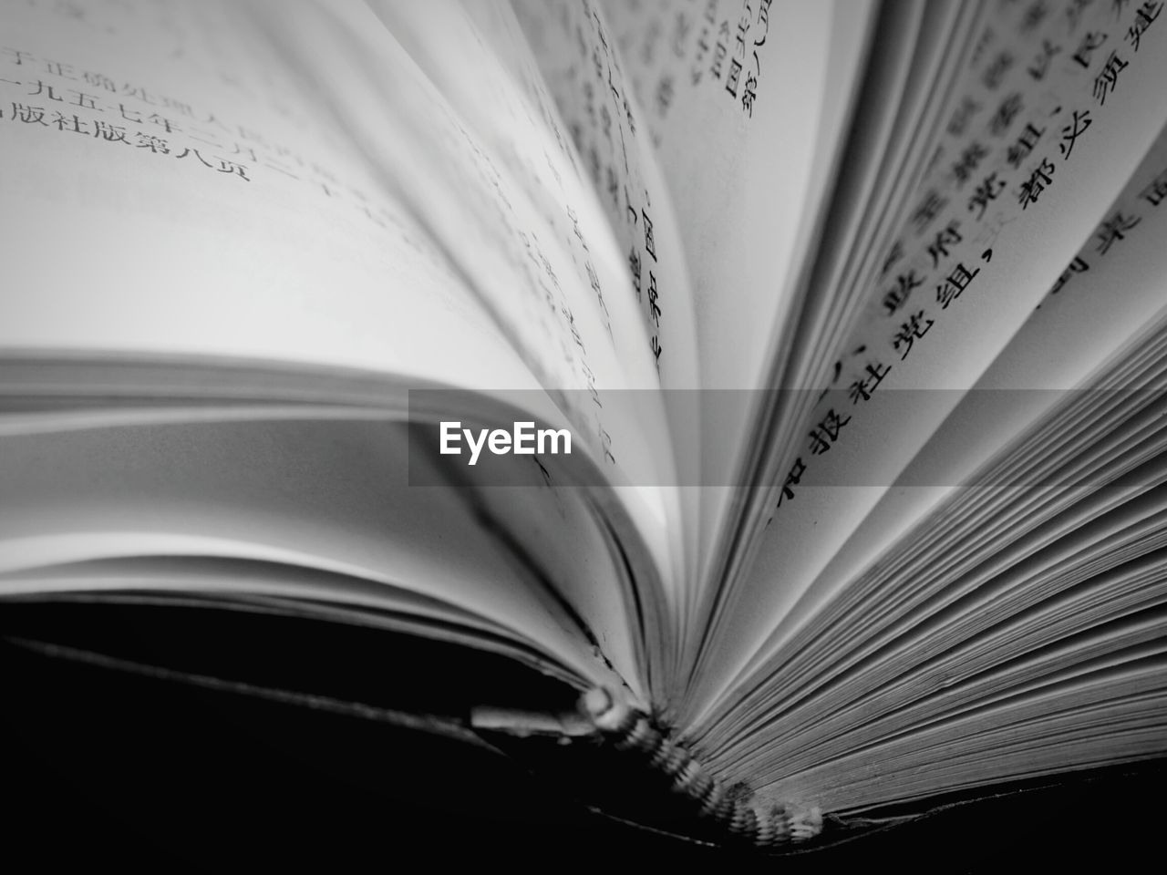 CLOSE-UP OF BOOKS ON TABLE