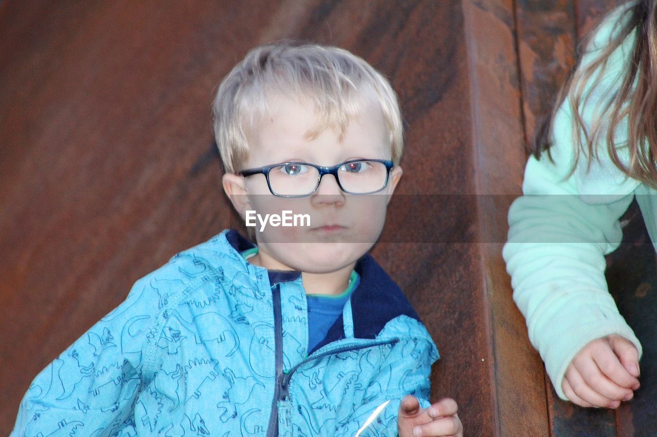 PORTRAIT OF CUTE BOY WITH EYEGLASSES