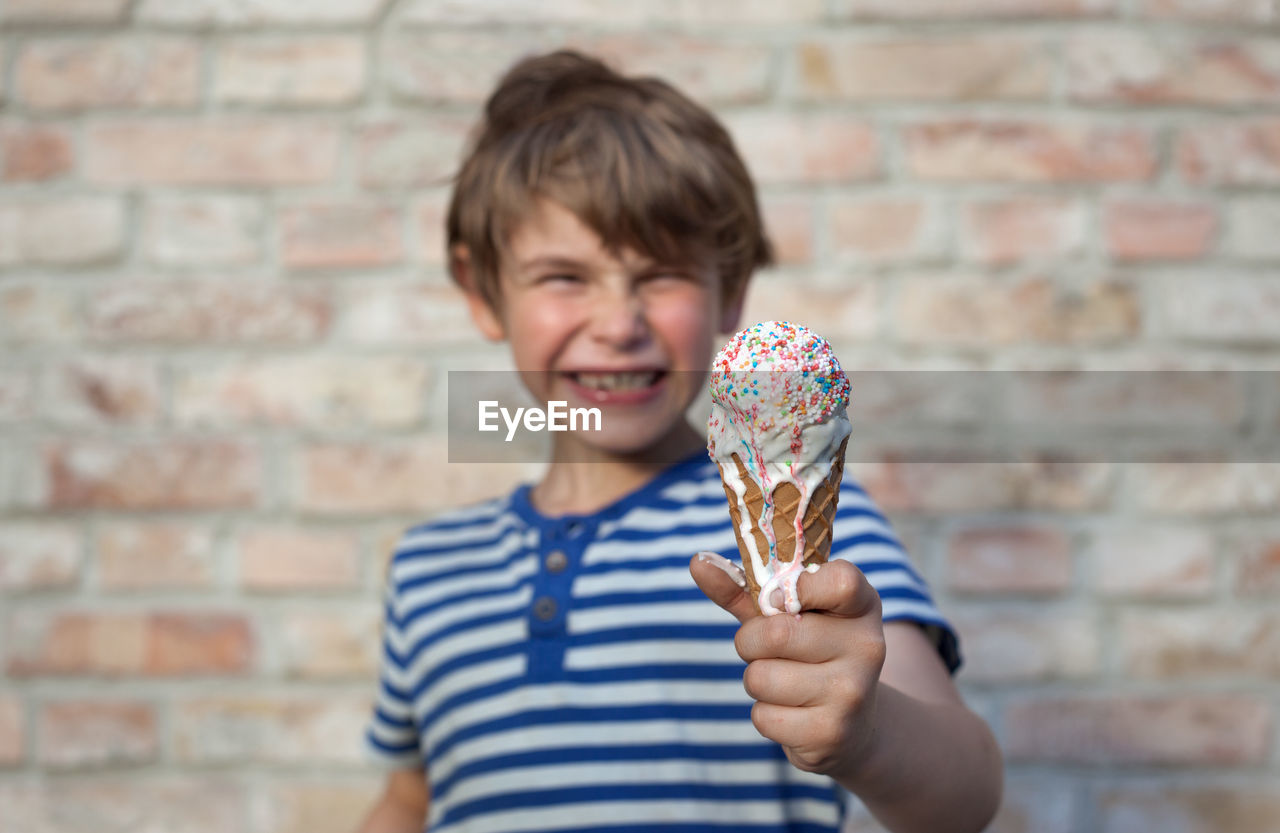 Portrait of boy holding ice cream