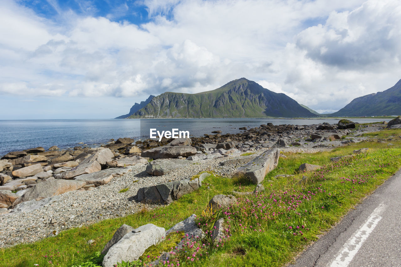 sky, water, coast, cloud, scenics - nature, sea, land, beauty in nature, nature, mountain, shore, landscape, environment, travel destinations, travel, rock, beach, tranquil scene, tranquility, no people, horizon, day, road, transportation, non-urban scene, ocean, body of water, outdoors, tourism, terrain, plant, vacation, cliff, bay, grass, coastline, highland, idyllic