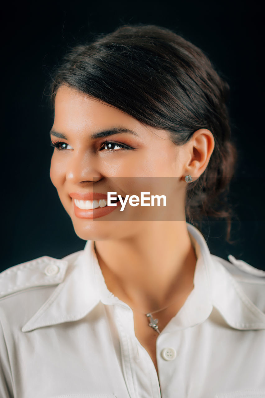 Beautiful young happy woman smiling, expressing positive emotions