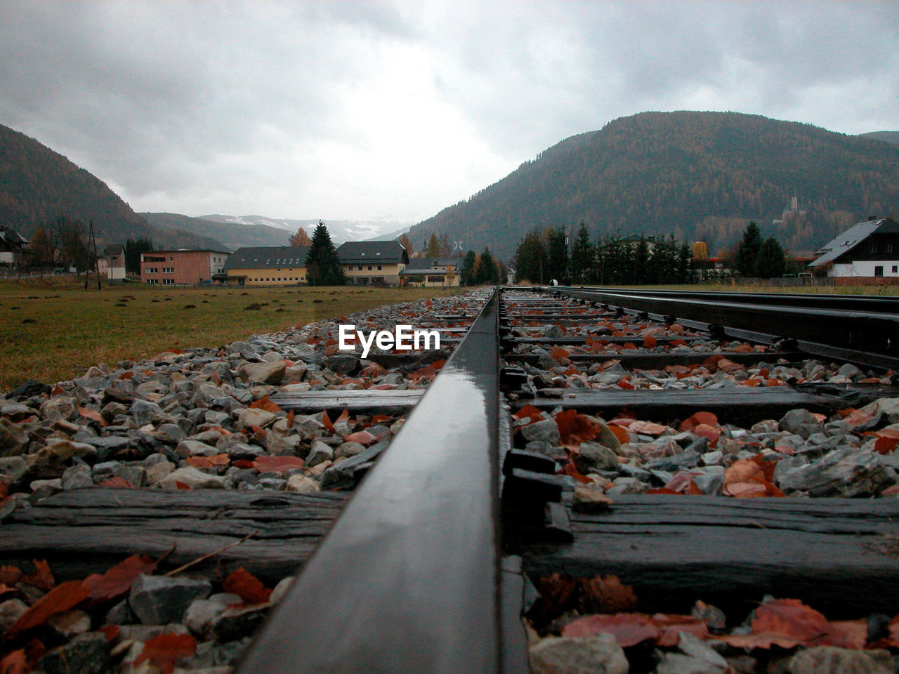 Wooden sleepers for railway tracks, rail traffic infrastructure on a sunny day