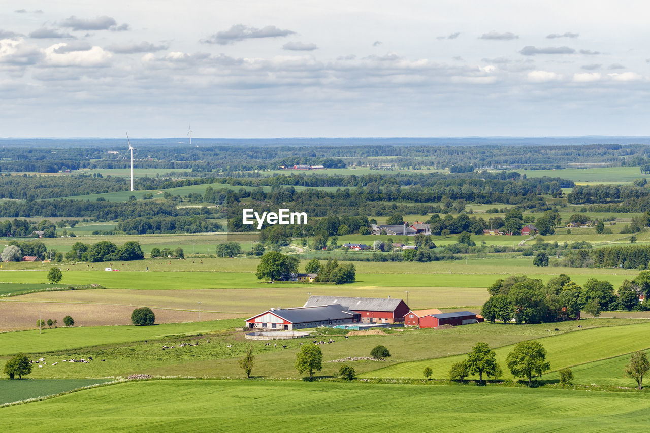 View of a rural landscape with fields and farm