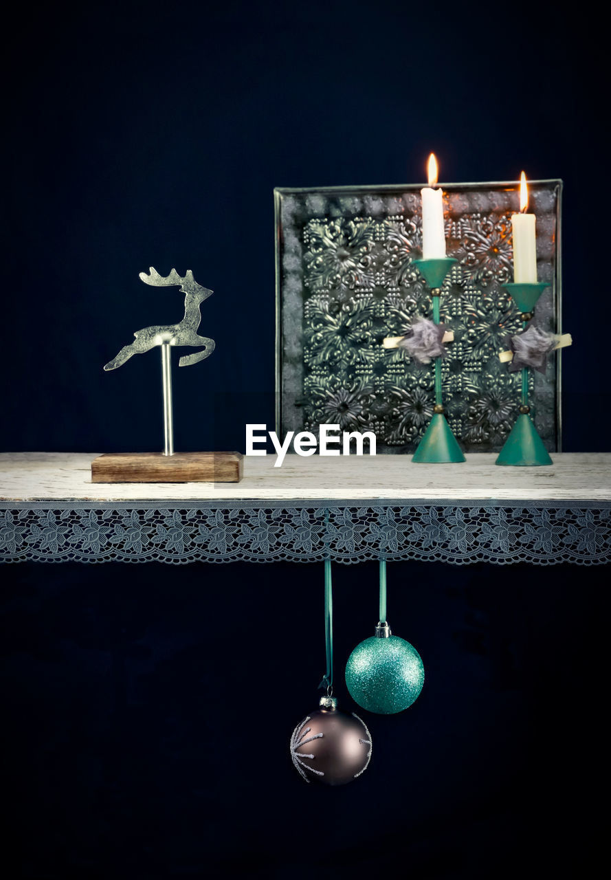 CLOSE-UP OF ILLUMINATED LIGHTING EQUIPMENT ON TABLE