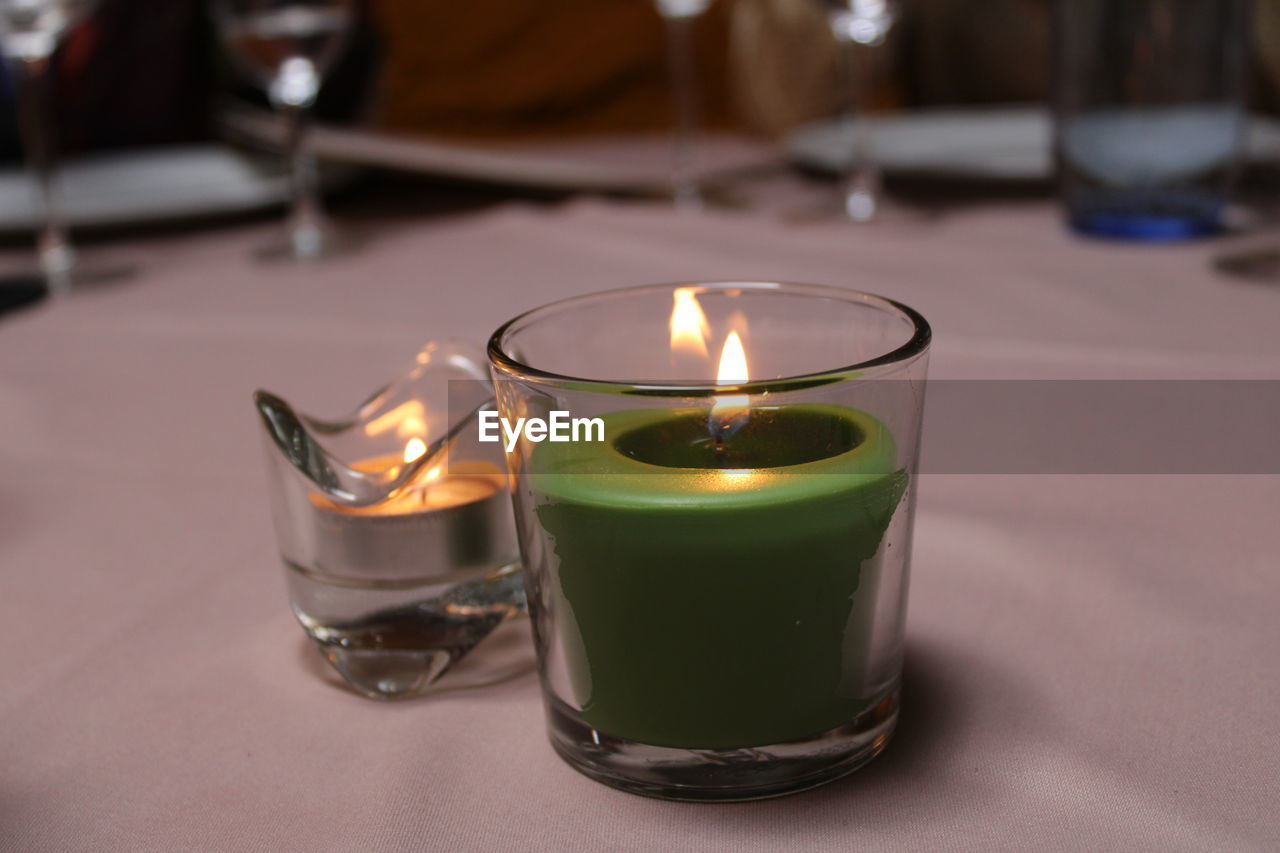 Close-up of tea light candle on table