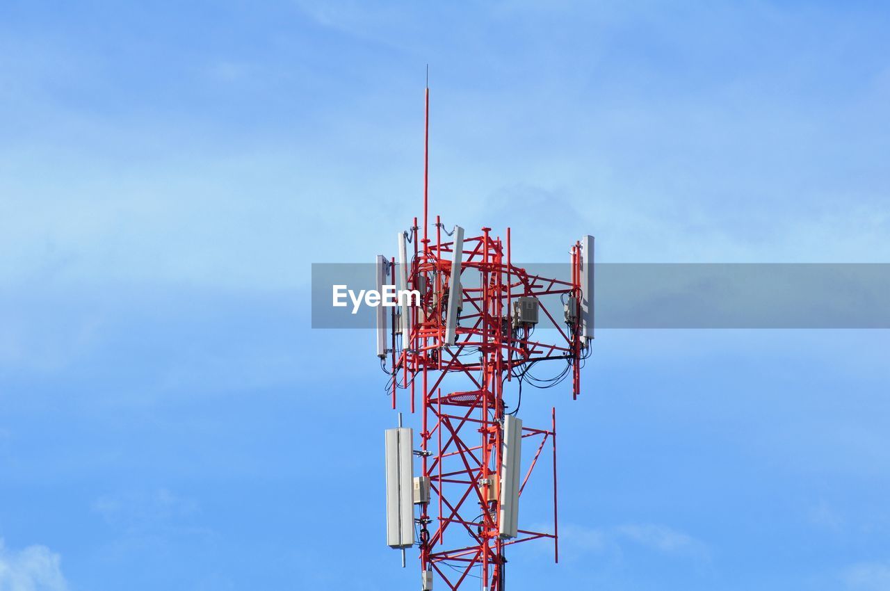 Low angle view of communications tower against sky