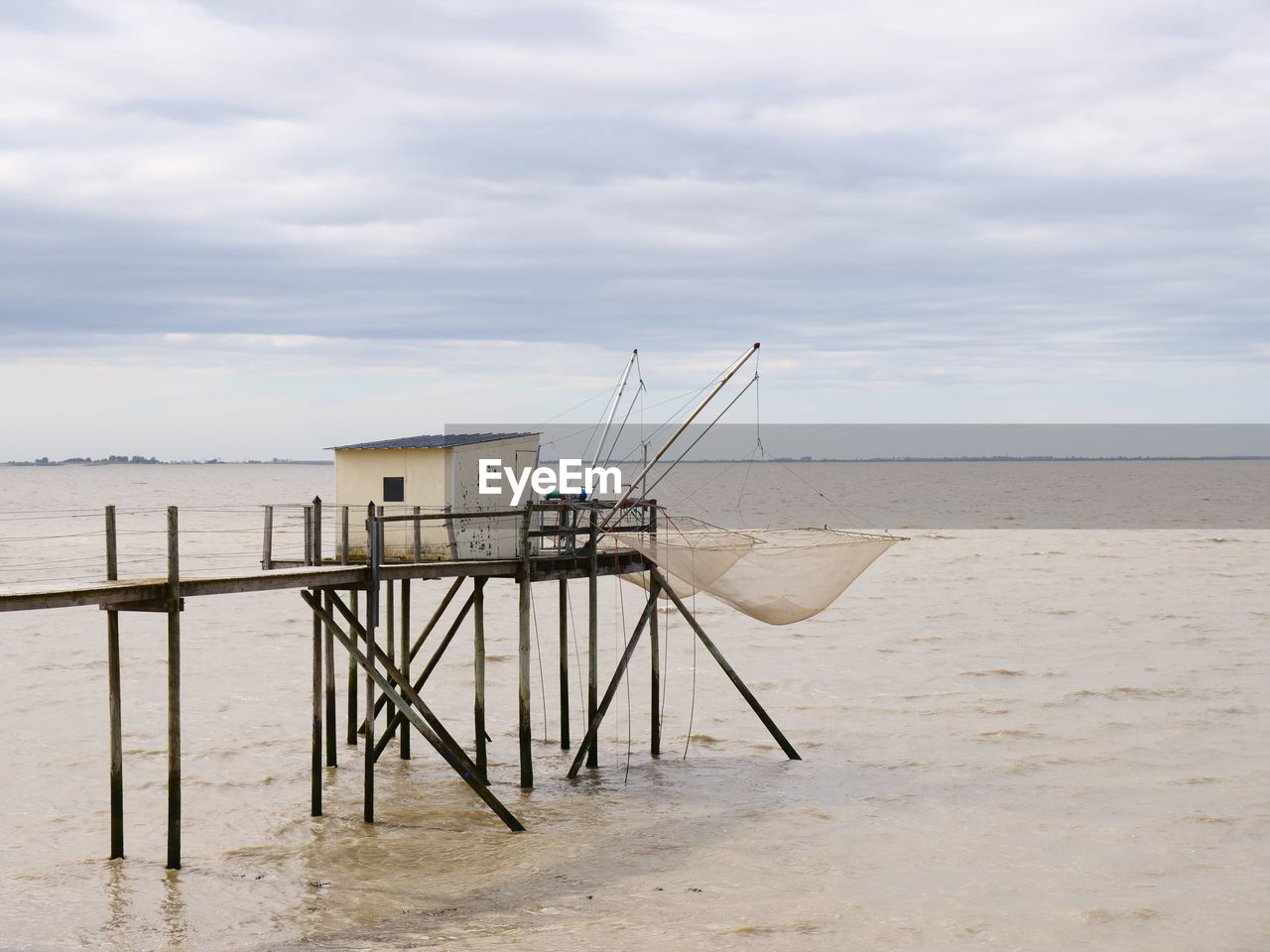 LIFEGUARD HUT ON SHORE AGAINST SKY