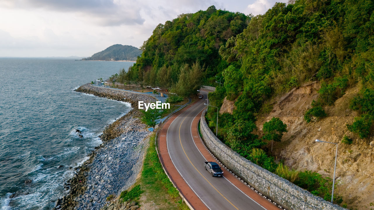 high angle view of road by sea against sky