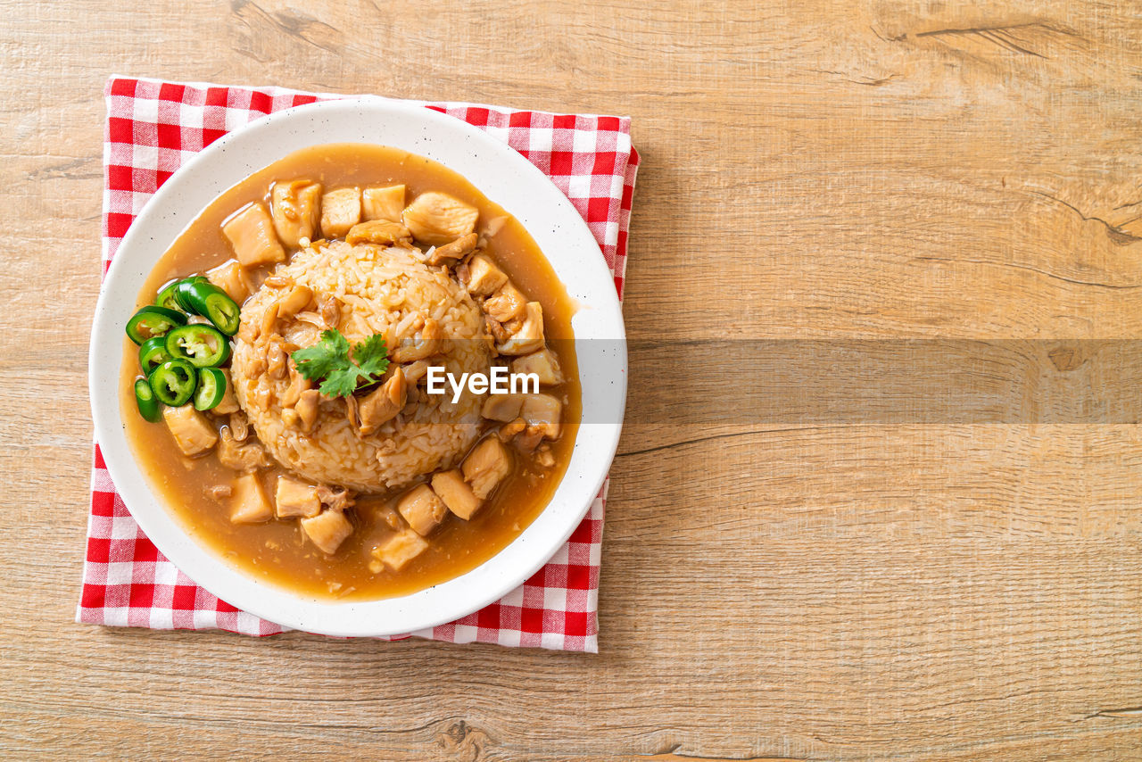 high angle view of food in plate on wooden table