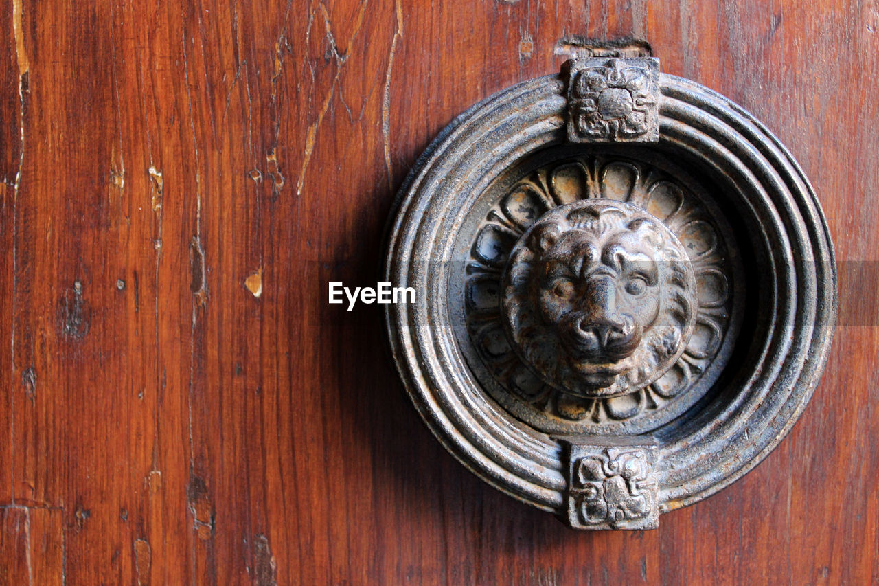 Close-up of on door knocker wooden door