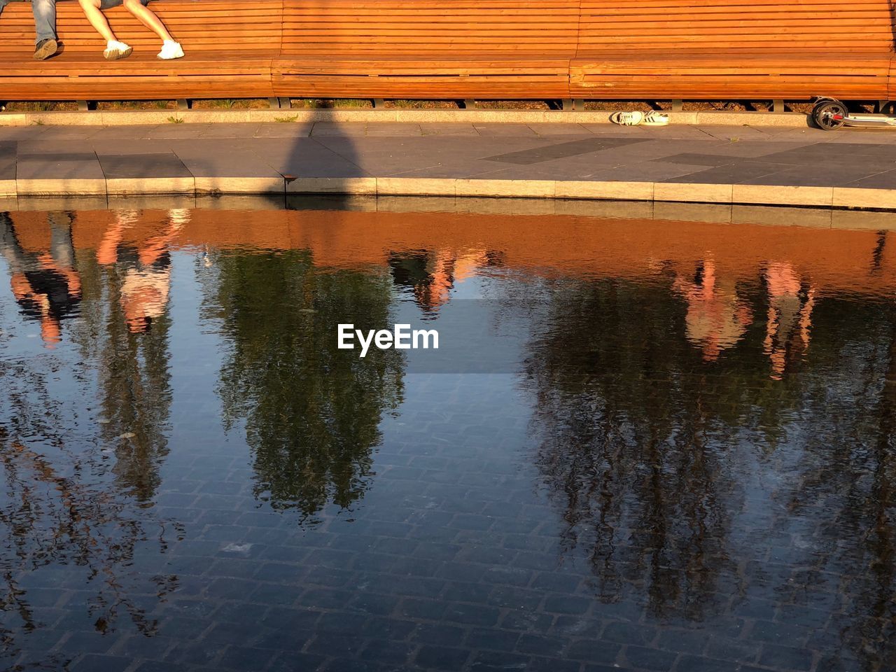 REFLECTION OF BUILDINGS IN PUDDLE