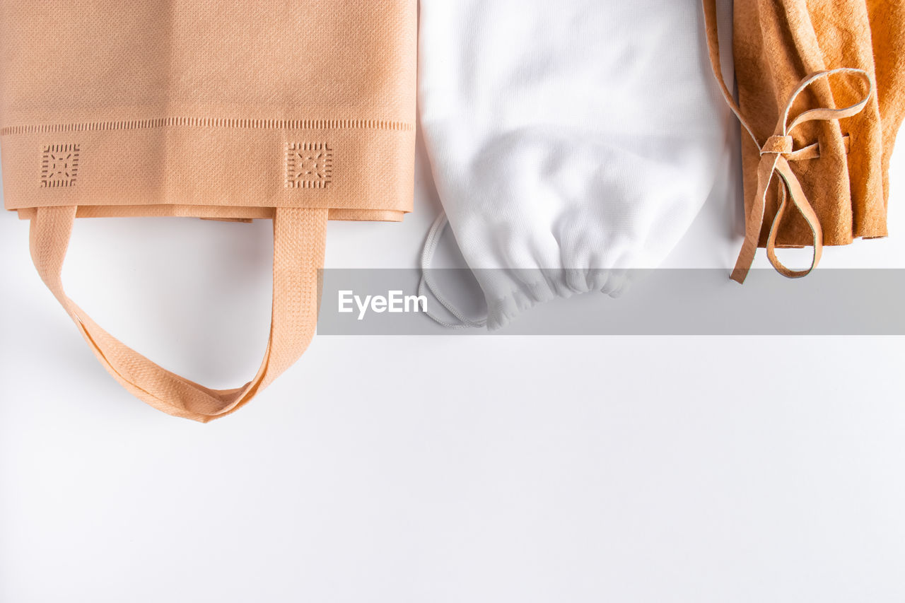 Eco-friendly recyclable bags on a white background. zero waste concept. place for text