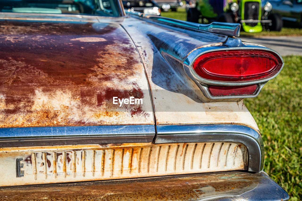 CLOSE-UP OF RUSTY CAR