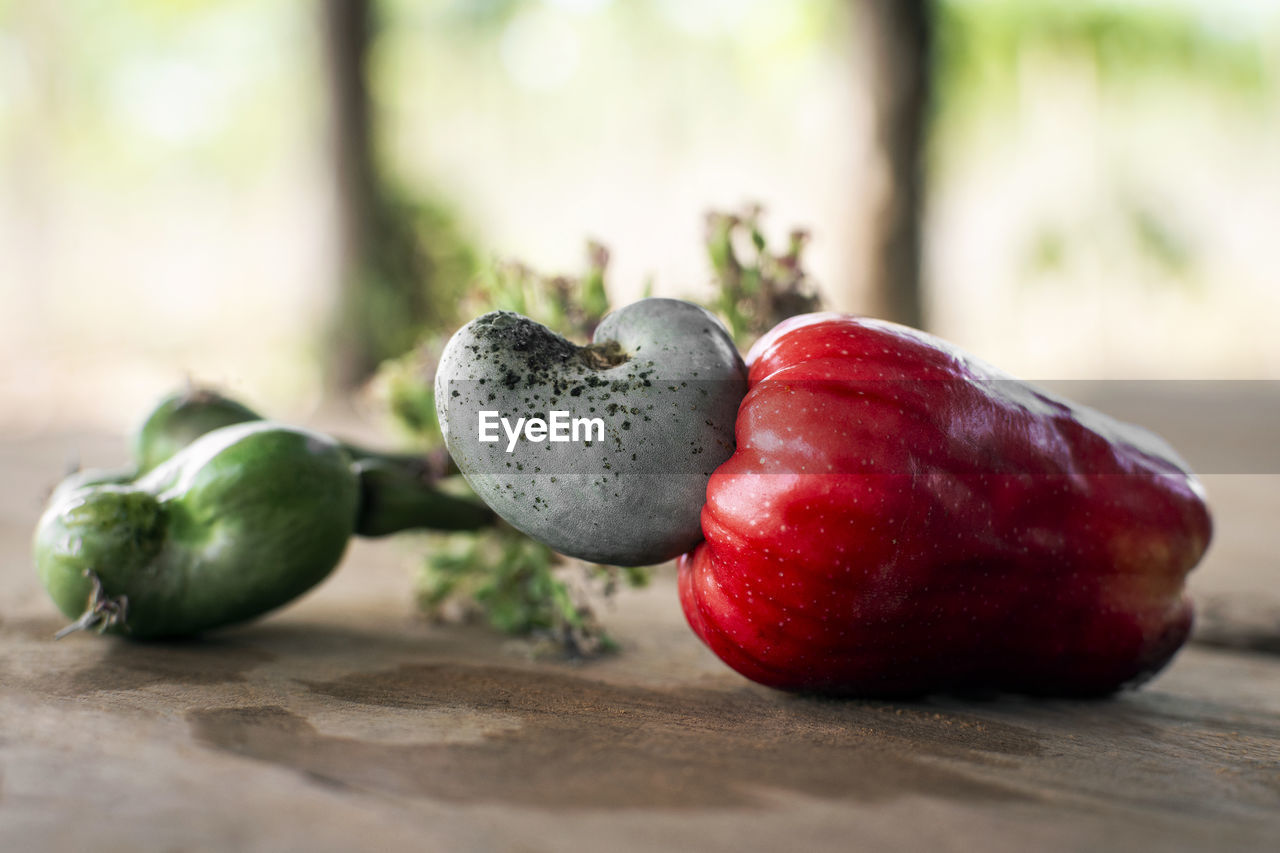 food and drink, healthy eating, food, freshness, wellbeing, fruit, plant, produce, red, wood, no people, close-up, vegetable, organic, selective focus, table, still life, nature, indoors, ripe, still life photography, focus on foreground, studio shot, group of objects, day, agriculture