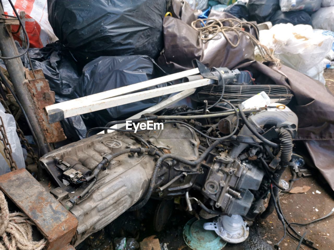 HIGH ANGLE VIEW OF GARBAGE IN ABANDONED CAR