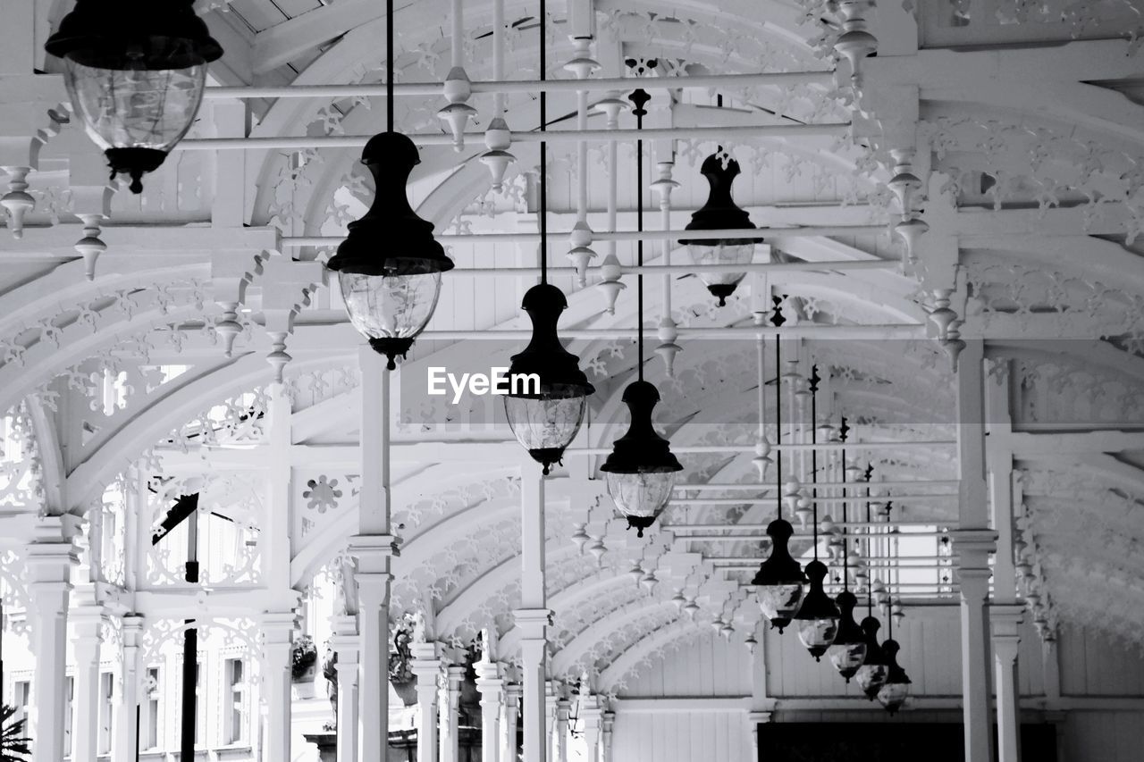 Low angle view of illuminated lanterns hanging in building