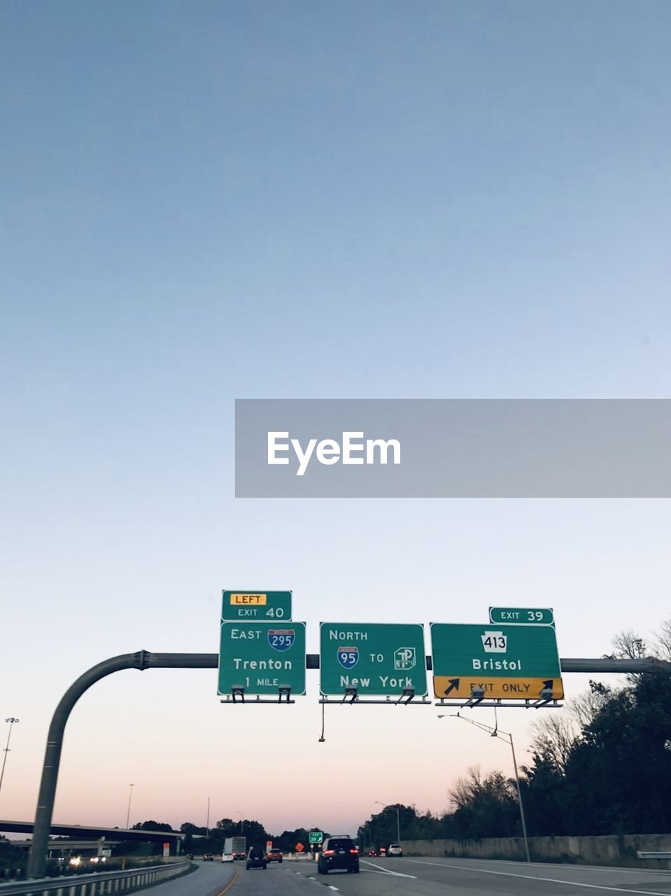 Road sign against sky