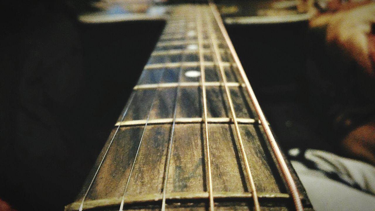 CLOSE-UP OF GUITAR IN THE STAGE