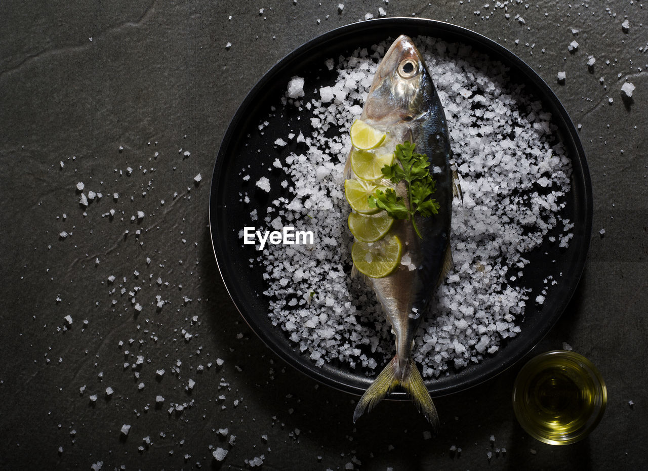 High angle view of fish in plate on table