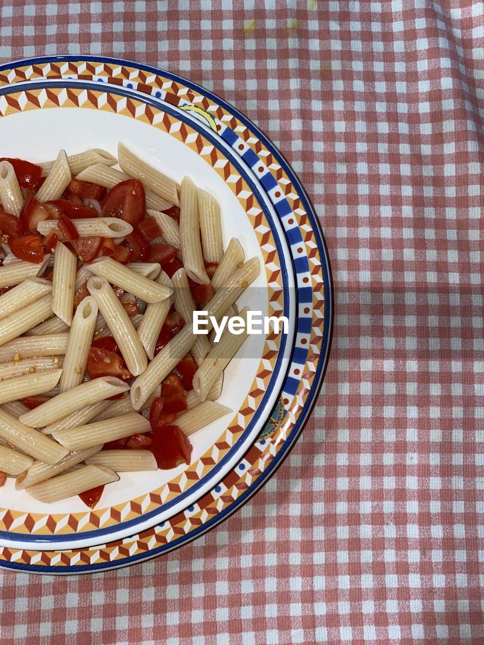 food and drink, food, fast food, directly above, healthy eating, indoors, freshness, tablecloth, wellbeing, still life, no people, checked pattern, dish, pattern, table, high angle view, plate, produce, pasta, cuisine, penne, italian food, snack, large group of objects, vegetable