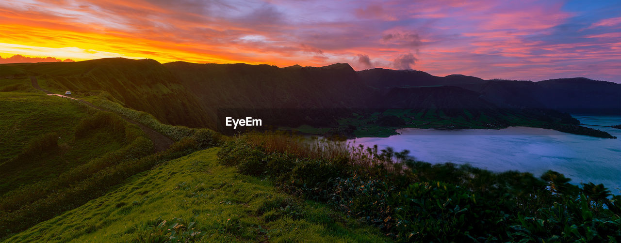 Scenic view of landscape against sky during sunset