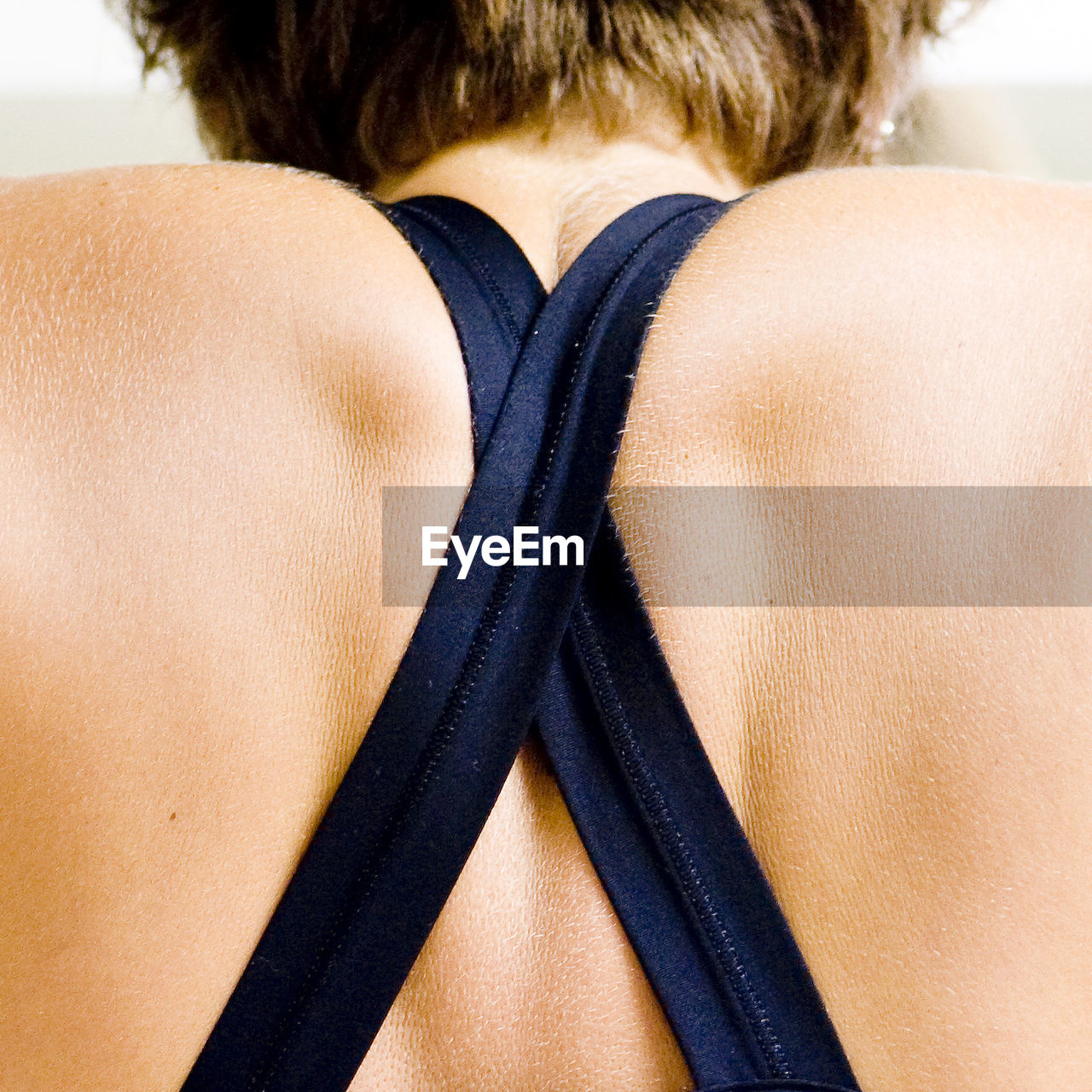 Rear view of woman wearing zipper