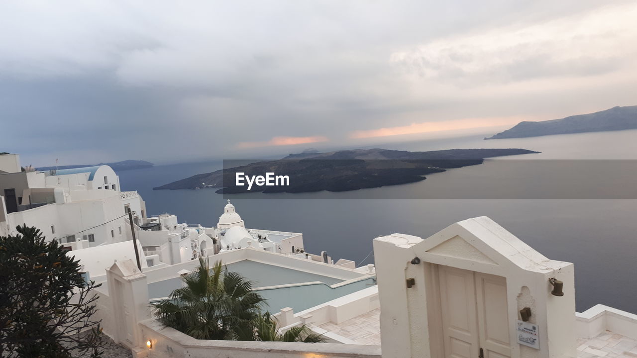 PANORAMIC VIEW OF BUILDINGS AND SEA AGAINST SKY