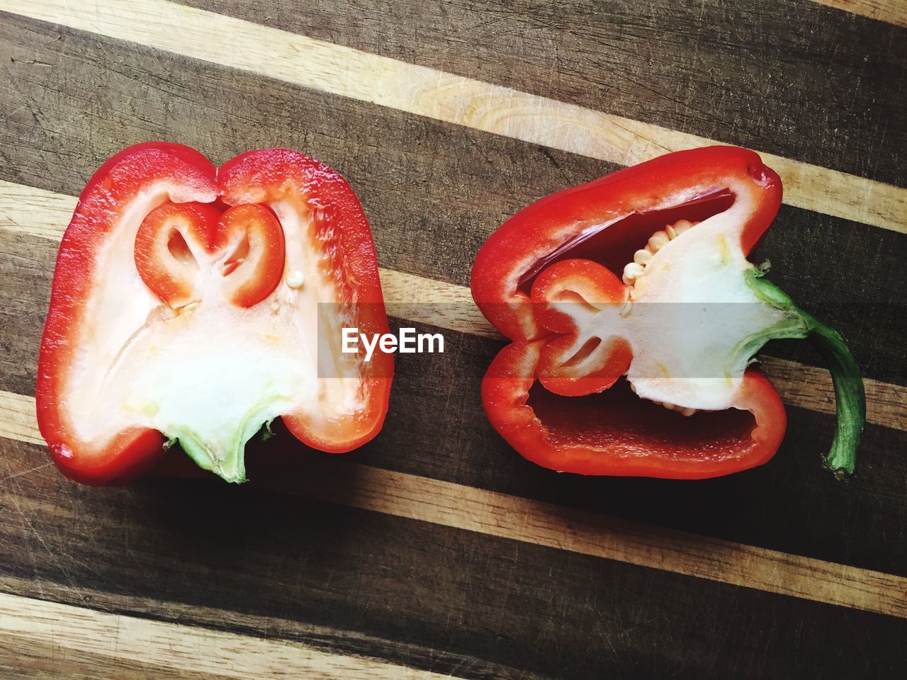 High angle view of red bell peppers on cutting board