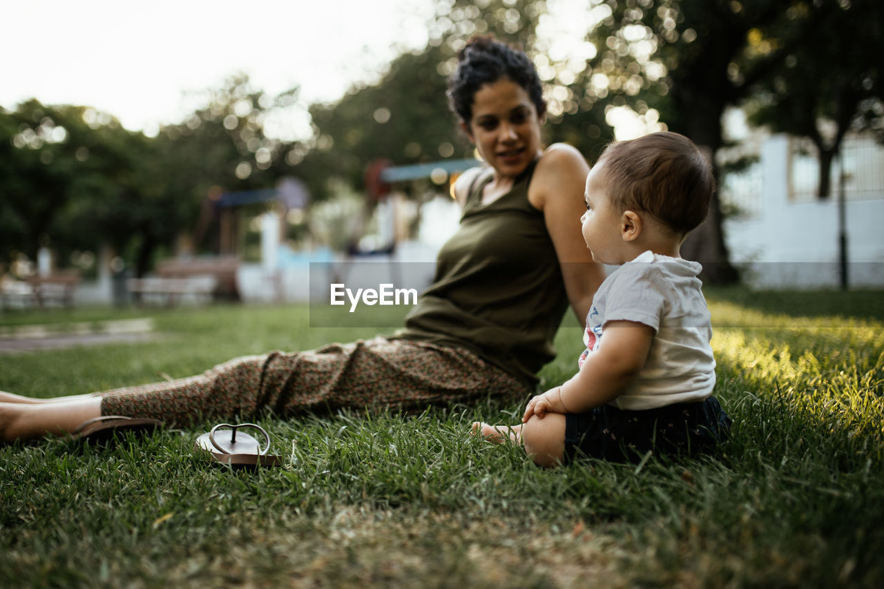 Father and son on grass