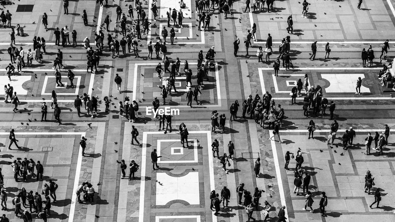 High angle view of people on tiled floor