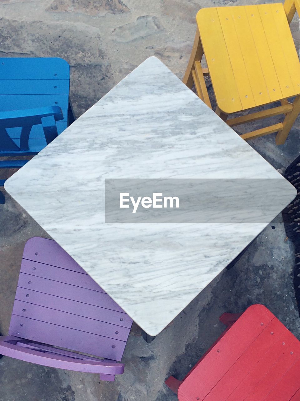 High angle view of table and chairs on beach