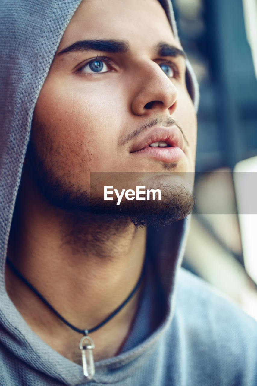 Close-up of young man looking away