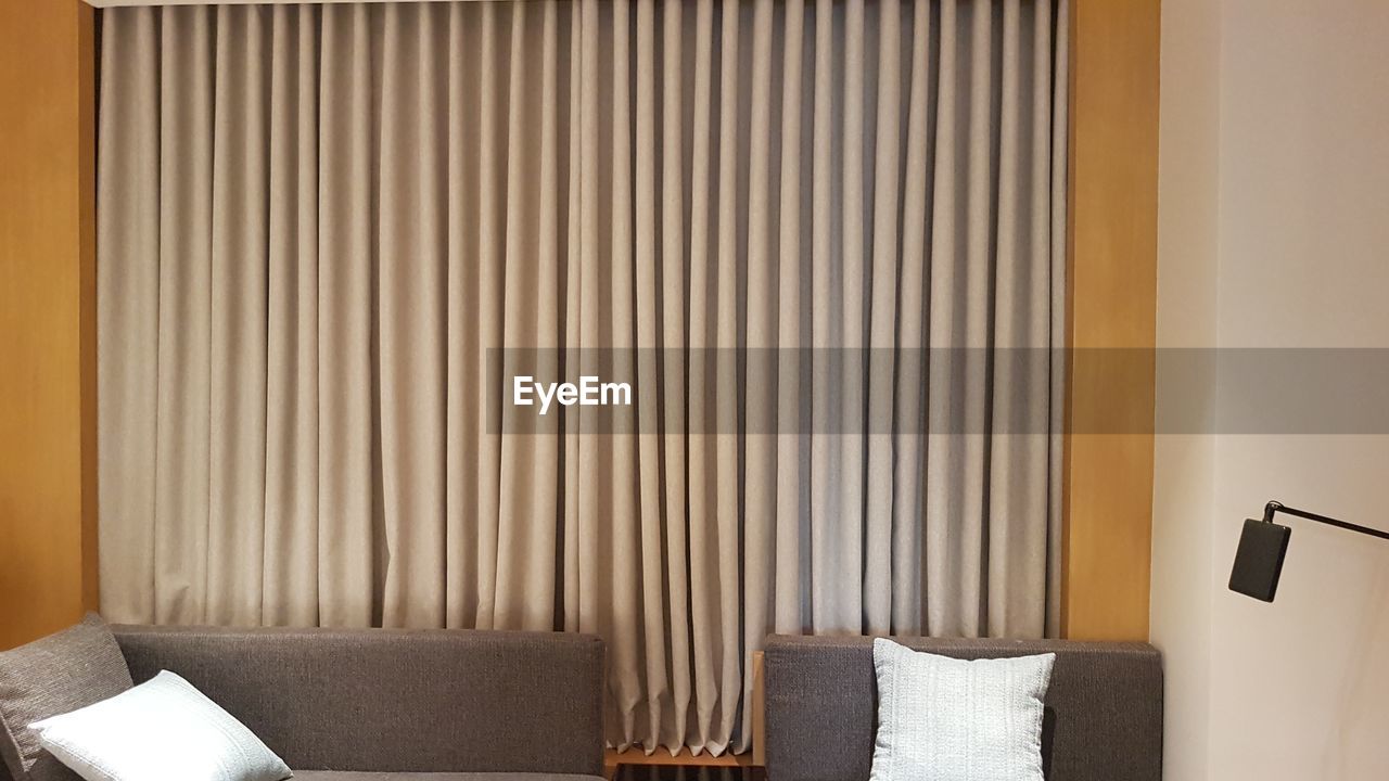 window covering, interior design, indoors, curtain, domestic room, furniture, window treatment, home interior, room, no people, textile, luxury, wealth, seat, chair, home, home showcase interior, architecture, hotel, technology, living room