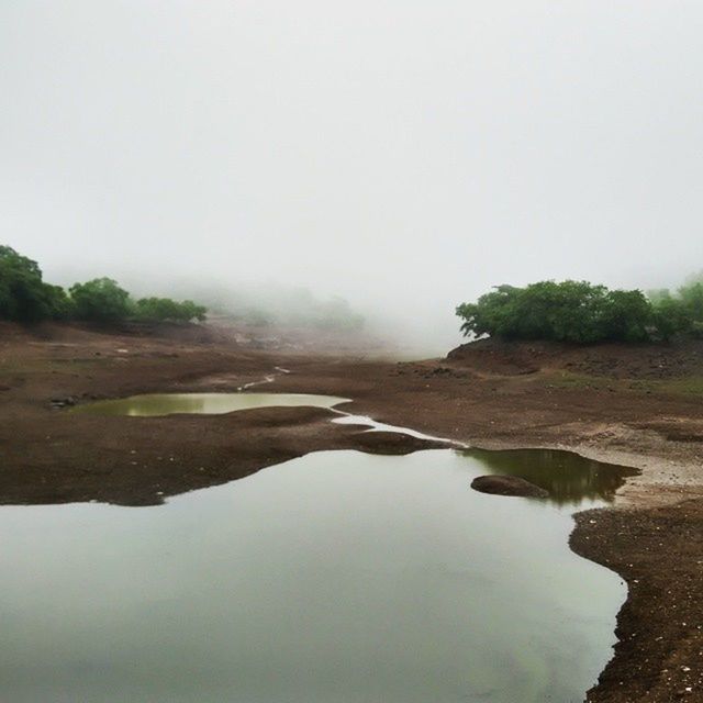 SCENIC VIEW OF RIVER WITH TREES IN BACKGROUND