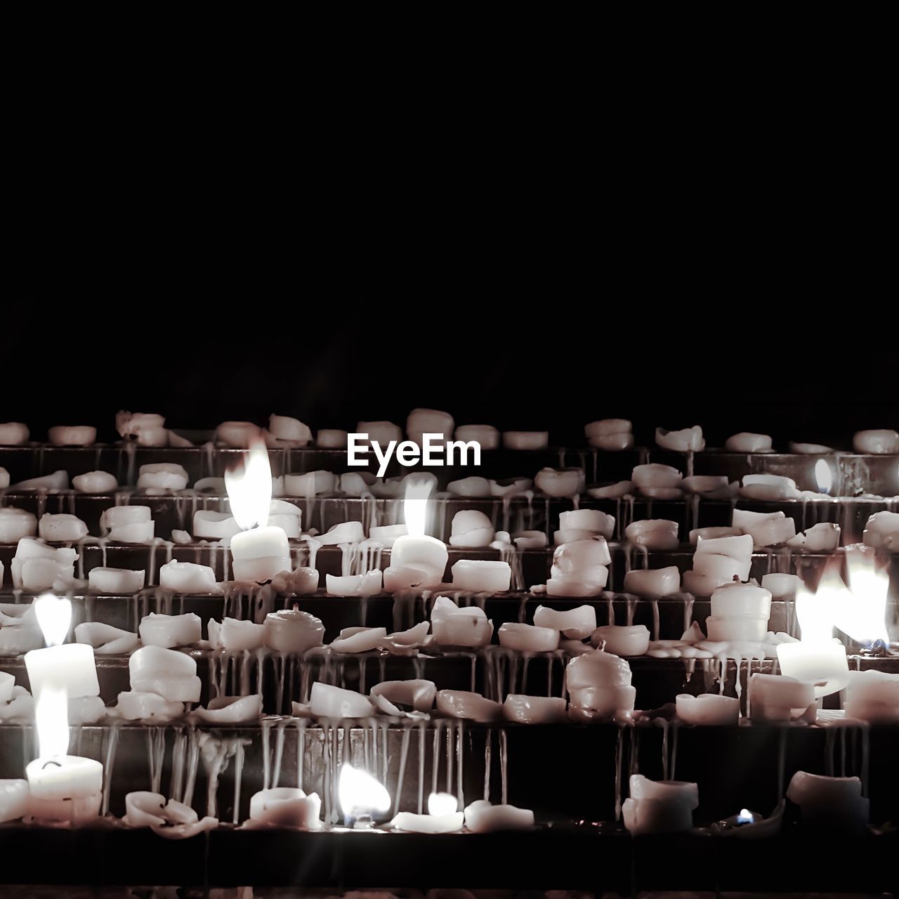 Close-up of illuminated candles on steps