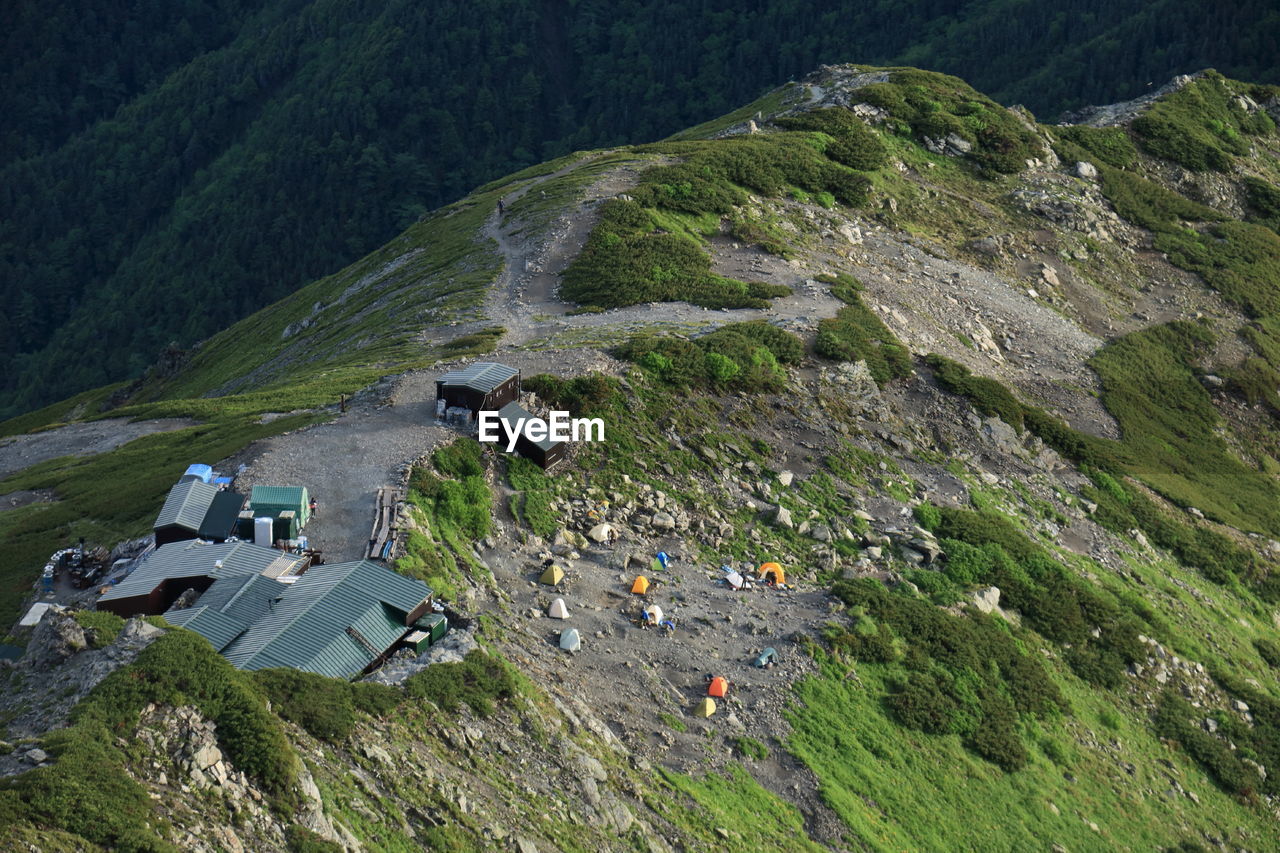 High angle view of cottages and tents at mountain peak
