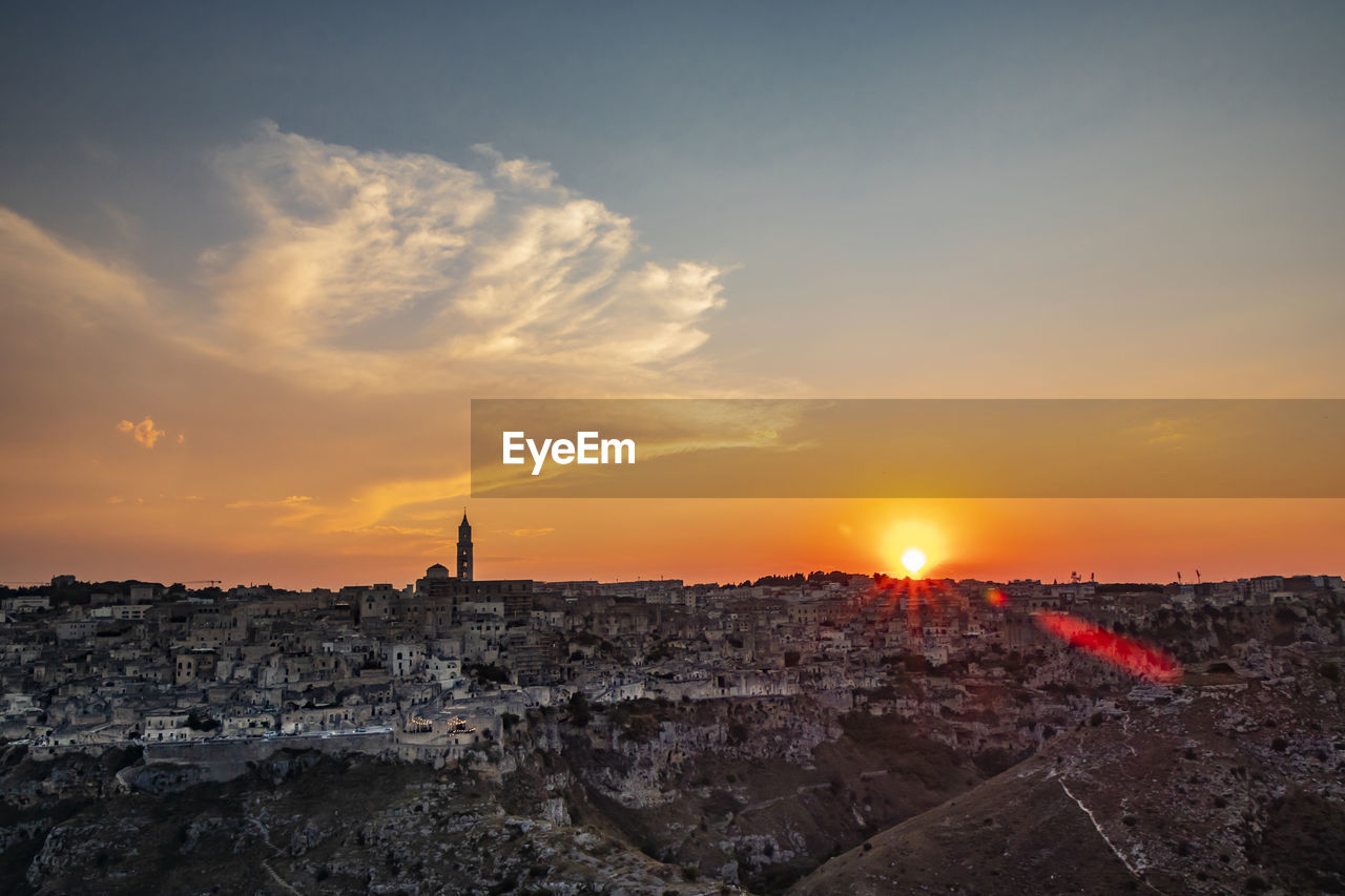 BUILDINGS AGAINST SKY DURING SUNSET