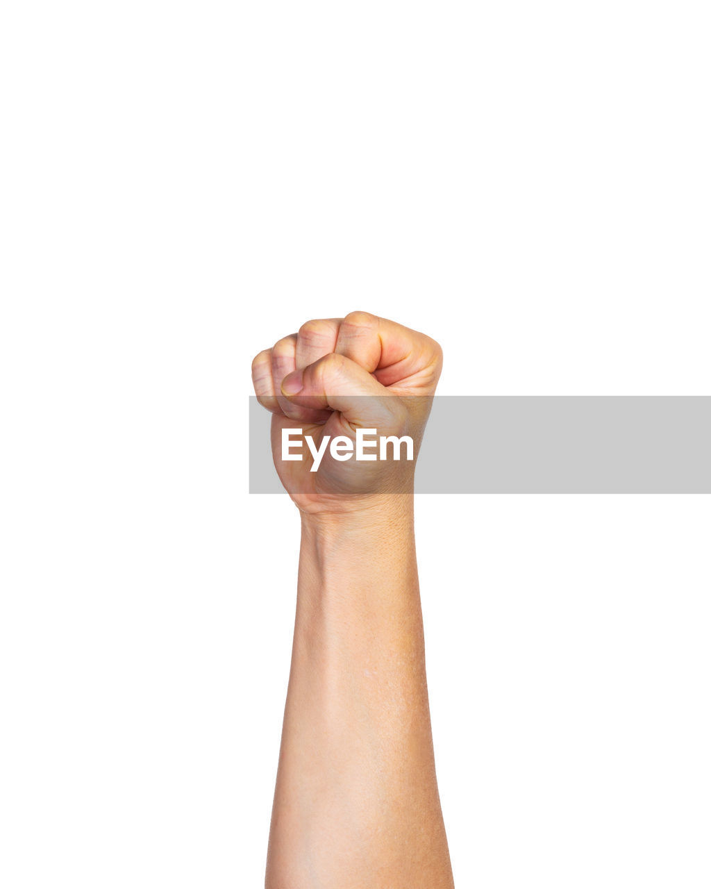 Close-up of cropped hand clenching fist against white background